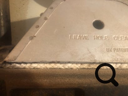 Ceramic fibre seal 2 on Netaheat flue hood.