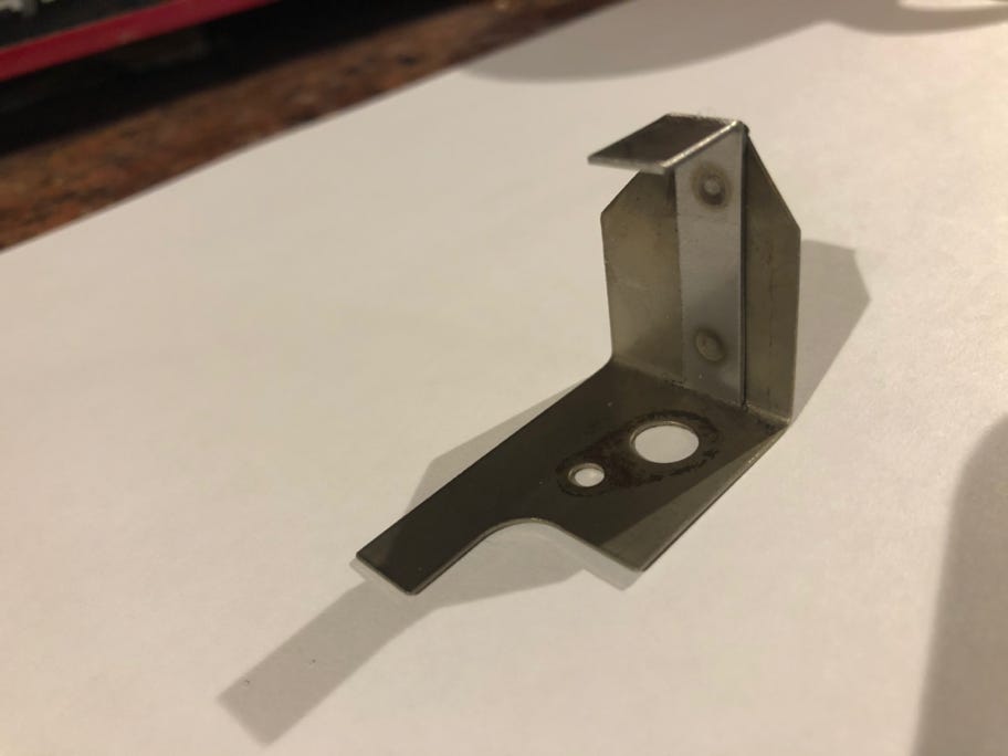 Netaheat earth bracket, tang eroded away with age and repaired by spot-welding a new tang into place